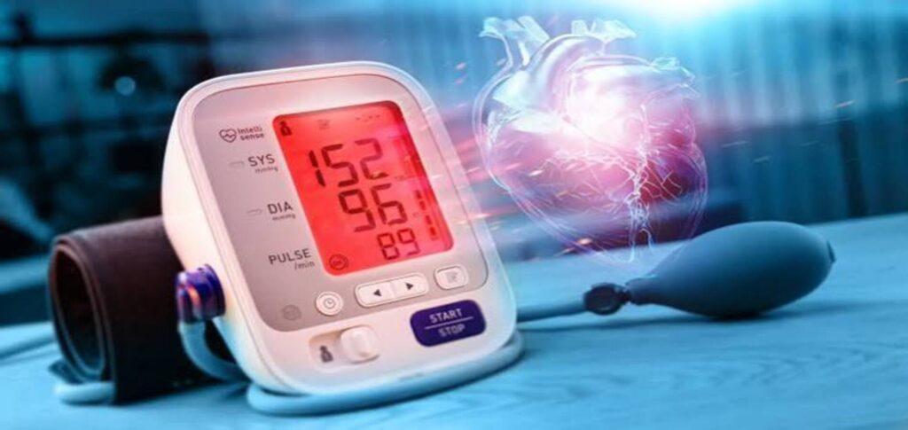 Scientists examining blood vessel cells under a microscope while analyzing calcium signals for a breakthrough in high blood pressure treatment.
