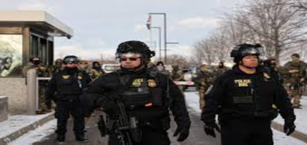 ICE officer wearing a body camera during an immigration enforcement operation as the agency faces scrutiny over video release policies.